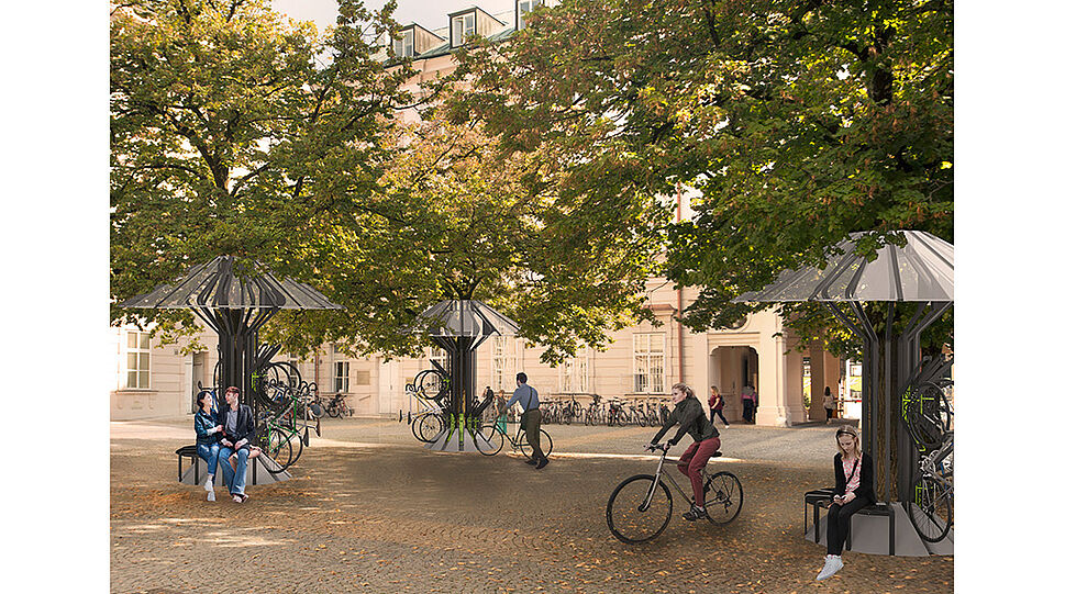 Menschen sitzen auf Bikeparker-Bank